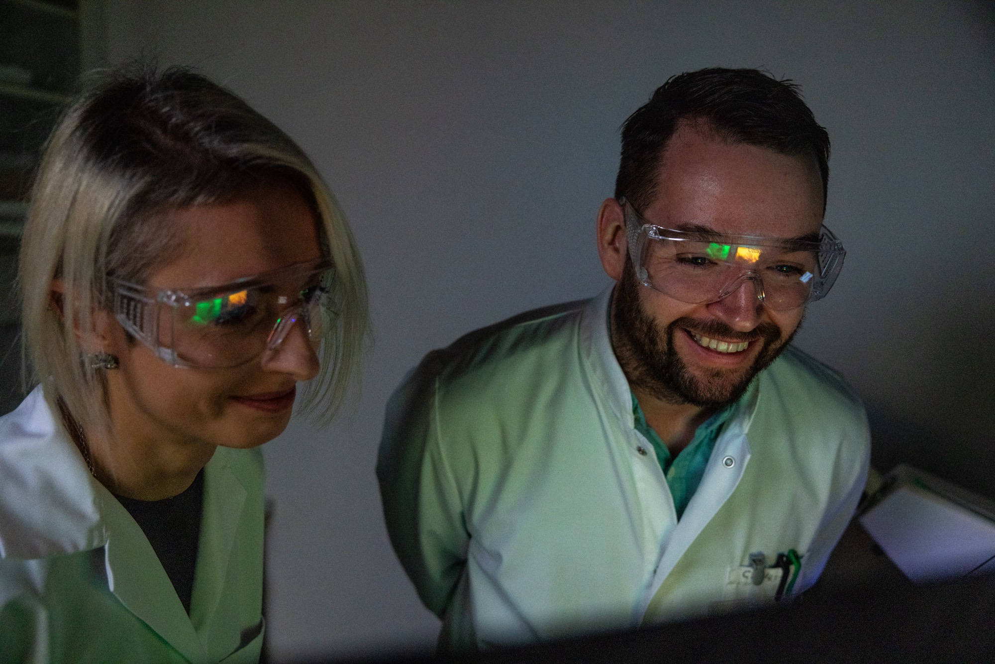 Two Arivin researchers at a screen