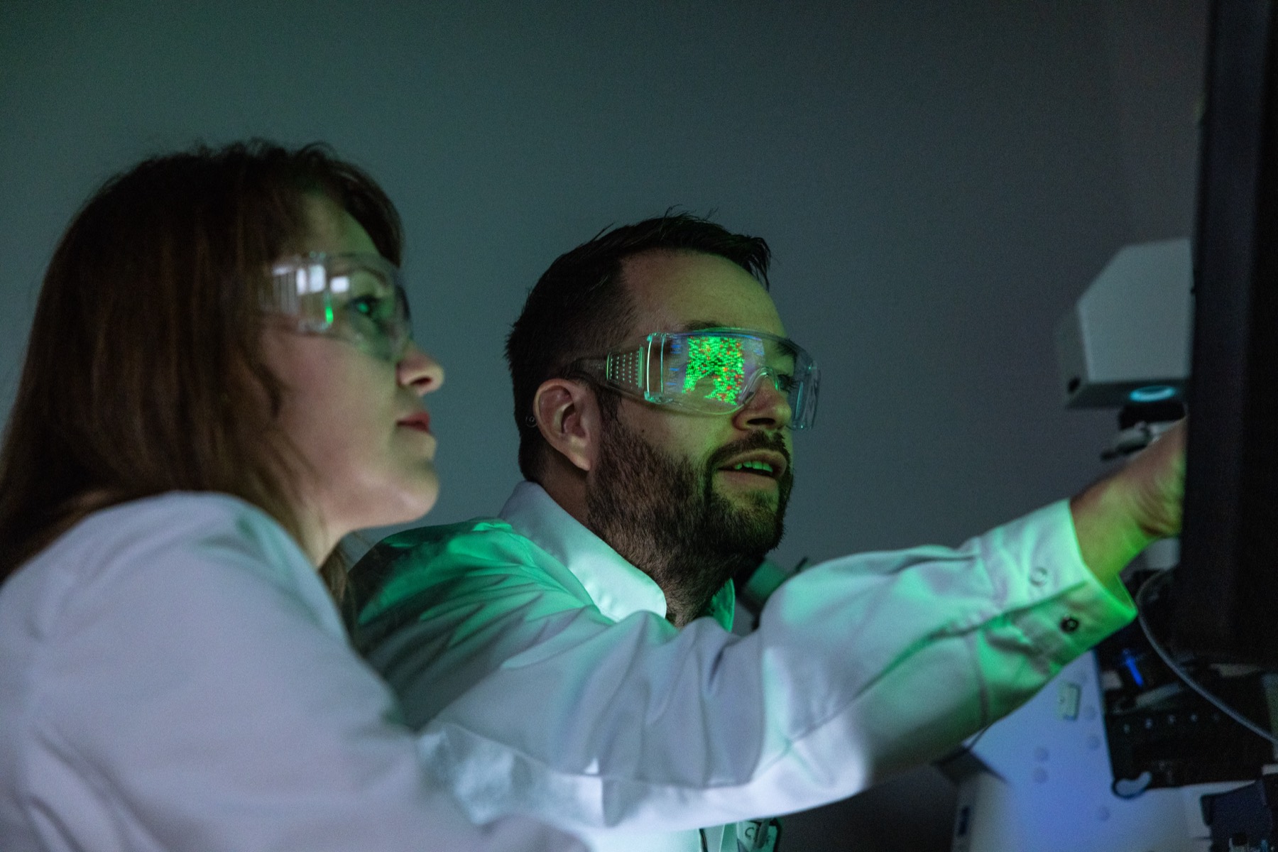 The Arivin team discussing results in the laboratory